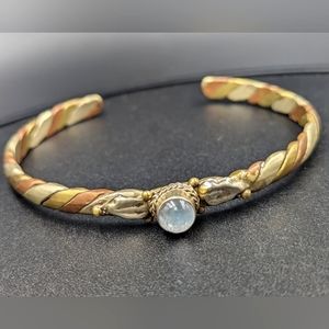 Gold copper and brass tone  focal stone open style bracelet